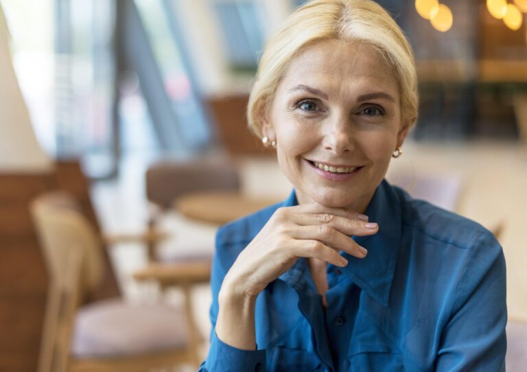 rsz_1front-view-older-business-woman-posing-while-out-work