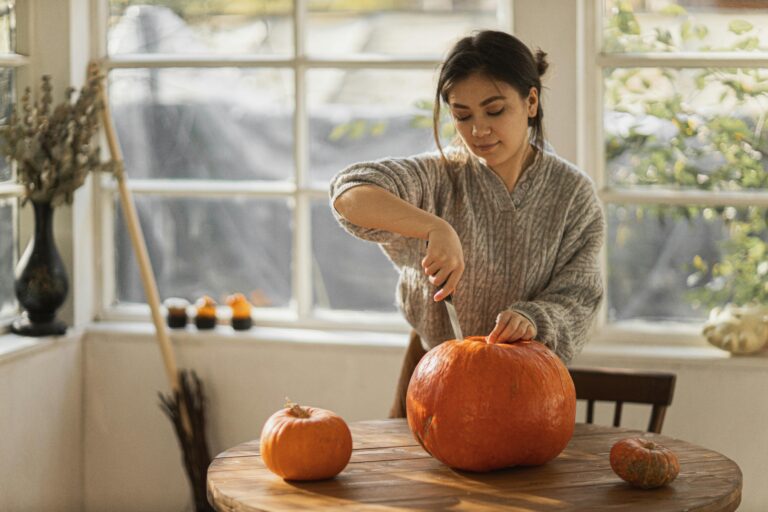 woman carving pumpkin after visiting dentist in Leon Valley